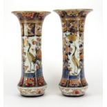 Pair of Japanese Imari porcelain vases each with hexagonal bodies, hand painted with birds of