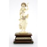 19th century Anglo-Indian carved ivory jewelled Goddess, raised on a carved rectangular rosewood