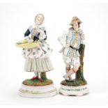 Pair of 19th century continental bisque figures including a flower seller, the largest 32cm high :