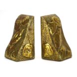 Pair of Scottish school Arts & Crafts brass bookends, each embossed with stylised a bird, each 15.