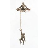 Unmarked silver and gold paste monkey brooch, overall 7cm in length, approximate weight 8.9g : For