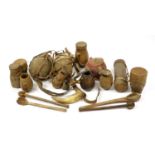 Tribal woodenware including spoons, drums and water carriers with cowry shells, the largest 52cm