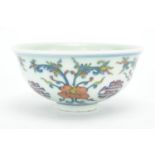 Chinese porcelain Doucai footed bowl, hand painted with flower head and foliage, six figure