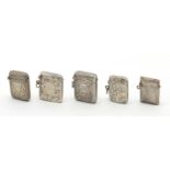 Five rectangular silver vesta's with engraved floral decoration, Birmingham hallmarks, the largest