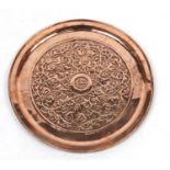 Large Arts & Crafts copper charger by Keswick, embossed with stylised floral motif, impressed