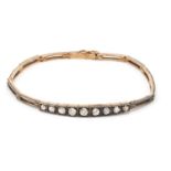 Antique gold diamond nine stone bracelet, the clasp marked 585, 17cm in length, approximate weight