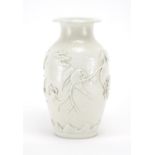 Chinese porcelain Blanc de Chine vase, decorated in relief with birds of paradise amongst blossoming