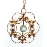 Art Nouveau 9ct gold aquamarine pendant on a 9ct gold necklace, the pendant 2.5cm in diameter,