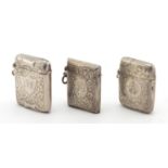 Three rectangular silver vesta's with engraved floral decoration, Birmingham and Chester