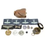 Military interest compass with tan leather case together with a group of cloth patches and badges