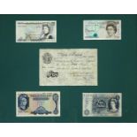 Framed display of five Bank of England five pound notes including a 1949 white example, serial