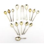 Russian silver flatware including a set of six silver teaspoons and a pair of sugar tongs, each with