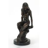 Ronald Cameron, patinated bronze study, Girl on Rock, raised on a circular black marble base,