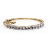 9ct gold sapphire and diamond bangle, G & T J makers mark, 6.5cm wide, approximate weight 16.1g :