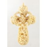 Victorian carved ivory cross pendant, decorated with berries and a wreath, 10cm in length,