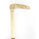 Oriental hyde walking stick with ivory handle, finely carved with rabbits, 87cm in length : For