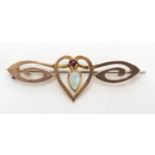 Art Nouveau unmarked gold opal and garnet bar brooch, 4.5cm in length, approximate weight 3.1g : For