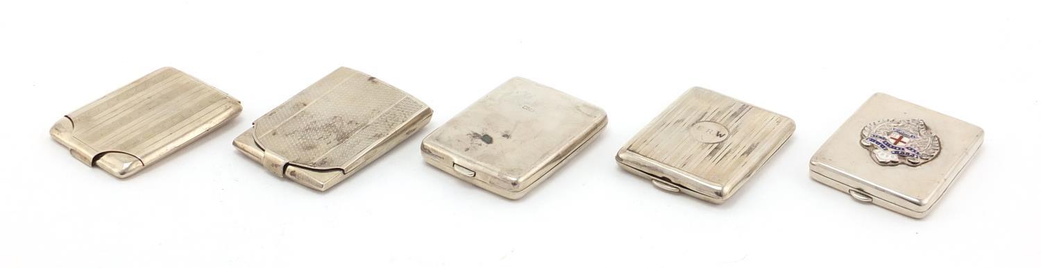 Five rectangular silver match cases some with engine turned decoration, various Birmingham