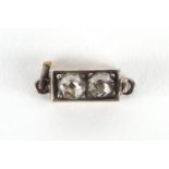 Unmarked gold diamond clasp, 9mm in length, approximate weight 0.9g : For Extra Condition Reports