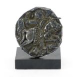 Circular Middle Eastern silver plaque, embossed with a huntsman on horseback, on stand, 9cm in