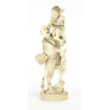 Japanese carved ivory okimono of a fisherman with a child holding a crab, red inset character