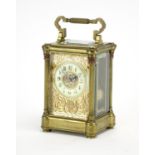 19th century brass cased carriage clock striking on a gong, with architectural columns, pierced
