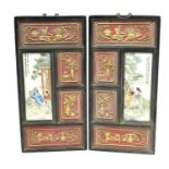 Pair of Chinese porcelain panes housed in carved hardwood frames, each hand painted in the famille