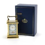Halcyon Days enamel brass cased carriage clock, with Roman numerals and fitted box, 12cm high :