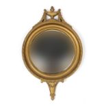 Gilt circular convex mirror with urn decoration, 64cm high : For Extra Condition Reports Please