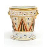 19th century porcelain Cache pot on stand with ring turned lions head handles, hand painted and