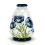 Miniature Macintyre Moorcroft pottery vase, hand painted and tube lined in the Blue Poppy pattern,