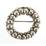 Chinese silver brooch with impressed character marks to the reverse, 3.5cm in diameter,