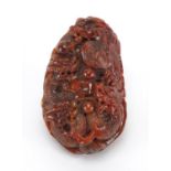 Chinese red hardstone touch stone carved with dragons, 7cm high : For Extra Condition Reports Please