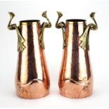 Pair of German Arts & Crafts copper and brass vases with bird design handles and tapering bodies,