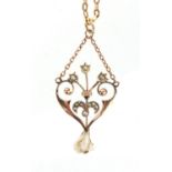 Art Nouveau 9ct gold seed pearl pendant on a 9ct gold necklace, the pendant 4.7cm in length,