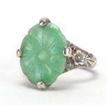 Chinese silver and green jade ring carved with a flower head, size K, approximate weight 4.5g :