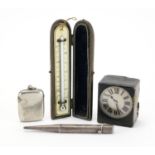 Miscellaneous objects comprising a silver vesta, Parker's pointer pencil, leather cased travel clock