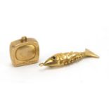 Two 9ct gold charms, articulated fish and vintage radio, the largest 3cm in length, approximate