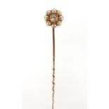 Unmarked diamond and seed pearl tie pin, housed in a Junghans tooled leather box, 7cm in length,