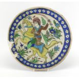 Circular Iznik pottery tile hand painted with a warrior on horseback, 37cm in diameter : For Extra