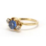 18ct gold blue stone and diamond crossover ring, size P, approximate weight 3.4g : For Extra
