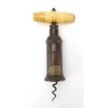 19th century Dowler patent brass corkscrew, with turned ivory handle and steel worm, 18.5cm in
