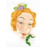 Czechoslovakian Art Deco pottery face mask of a female, impressed 15380 to the reverse, 22cm