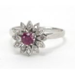 18ct white gold ruby and diamond flower head ring, size O, approximate weight 3.2g : For Extra