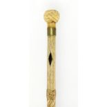 Antique carved whale bone walking stick with carved ivory Turk's head knop, 78cm in length : For