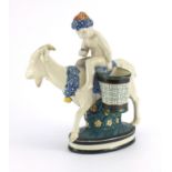 Continental porcelain figure of a young boy on a goat, factory marks and numbered 1003 to the