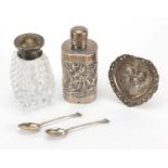 Silver objects comprising an aesthetic bottle holder, heart shaped pin dish, two teaspoons and a cut