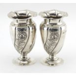 Pair of Art Nouveau silver pedestal vases, embossed with stylised flowers, by Gibson & Co Ltd London