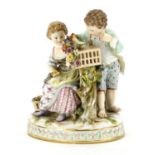 19th century Meissen porcelain figure group of two children nesting a chick, blue cross sword