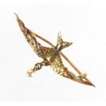 9ct gold swallow bar brooch set with a seed pearl, 4cm in length, approximate weight 1.4g : For
